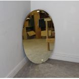 A large oval bevelled mirror, 97cm x 60cm formally a dressing table mirror.