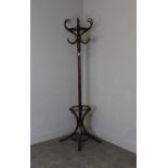 A modern bentwood coat/hat stand, of traditional form with s-scrolled hooks and circular division