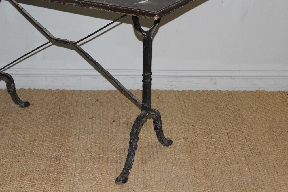 A cast-iron base pub table with moulded rectangular top above scroll cast trestle type supports - Image 2 of 3