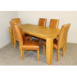 A large blocked light oak dining table 76cm x 199cm 100cm and six brown leather upholstered dining