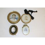 A brass framed photographic portrait on porcelain plaque 6.5cm together with three framed