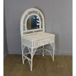 A white-painted woven-wicker dressing table, with arched mirror and single frieze drawer 137cm x