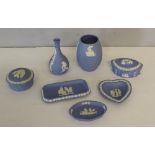 A group of seven Wedgwood blue jasper ware items, vases, trinket boxes, trays
