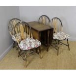 A mid 20th century oak drop-leaf table and four wheel-back chairs 73cm x 86cm x 42cm (closed) & 91cm