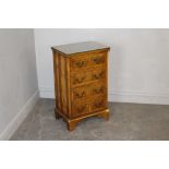 A small yewwood effect chest of four drawers 74cm x 44cm x 33cm marks and scratches, repairs to