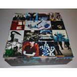 U2 Achtung Baby Uber Deluxe Edition box set with magnetic puzzle tiled cover, in good condition.