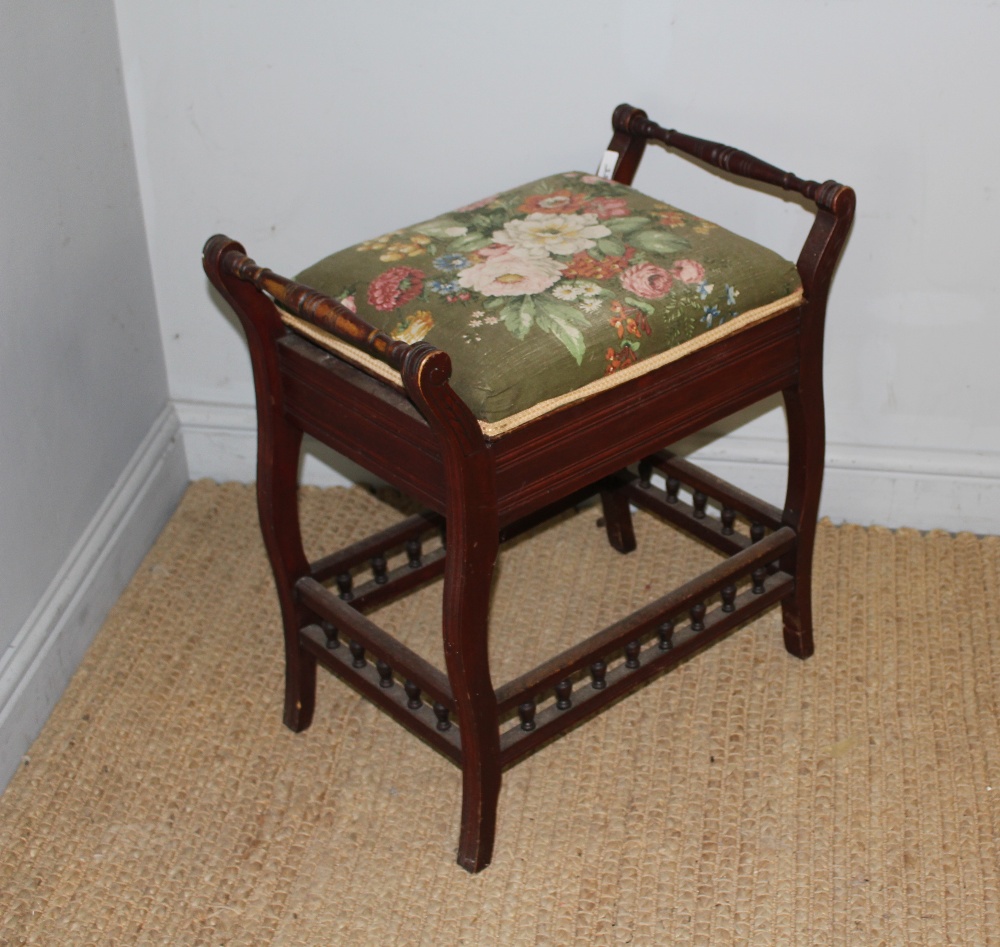 A late Victorian mahogany piano stool, the cushioned hinged seat between scrolled out and spindle - Image 3 of 3