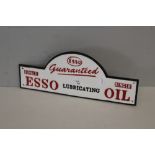 A reproduction painted cast-iron 'Esso Oil' sign of oblong form with central arch, cast in relief