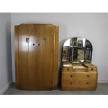 A 1930's Art Deco oak two-piece bedroom suite, comprising a double wardrobe and dressing chest (2)