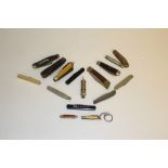 A collection of various pocket knives, and a Noble police style whistle.