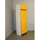 A Vintage 1970's orange fronted kitchen cupboard 198.5cm x 53cm x 53cm some chips to base kick