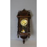 A modern mahogany 'Vienna Regulator' style wall clock, of small proportions 77cm good condition.