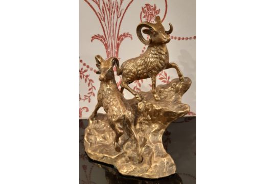 Early 20th century brass figure of two ibex / mountain goats on rocky outcrop, 20cm high