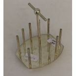 A silver plated toast rack, after a design by Sir Christopher Dresser, with tubular upright