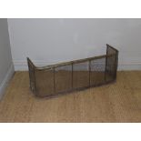 A 19th century brass and wire mesh fender/spark guard 38cm x 100cm x 30cm some corrosion and