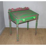 An antique pine school or clerks desk, with short gallery, hinged slope and dummy drawer on turned