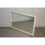 A rectangular wall mirror, with moulded frame painted in pastel tones 69cm x 99cm some marks to