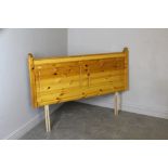 A modern pine double headboard, in good used condition