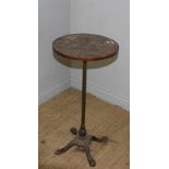 A Victorian cast-iron based telescopic stand with later circular top 85cm high some corrosion,