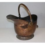 A Victorian copper coal helmet, with swing handle 32.5cm high used but good condition.