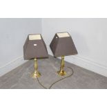 A pair of modern brass effect electrical table lamps, in good condition