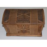 A Swedish carved wood casket, with geometric and stylised carving throughout, the domed and hinged