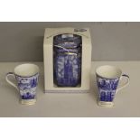 A Ringtons Millenium Cathedral jar, boxed 20cm and two Ringtons Millenium 2000 cups 11,5cm good