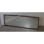 A 1970's oblong teak framed mirror, 48cm x 138cm generally good condition.