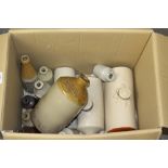 Three stoneware hot water bottles and a selection of stoneware bottles, including Glasson's