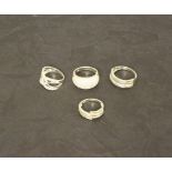 A group of four 925 grade white metal dress rings 15.7grams gross, stone missing from each