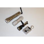 Four small flash lights/torches, good condition.