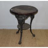 A cast-iron base Britannia bar table, with circular moulded top above the black painted base