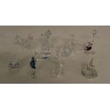 A selection of Swarovski crystal figures, including Winnie The Pooh, mermaid, Bambi, Little Red