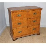 A 19th century scumbled-pine chest of three drawers, each drawer with rounded rectangular brass