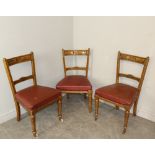 Three late Victorian oak dining chairs, the double tablet top-rail with incised scroll decoration