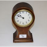 An Edwardian mahogany balloon shaped mantel clock, later converted to battery movement 20cm edge