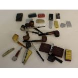 A selection of vintage smokers pipes and cigarette lighters, used condition.