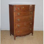 A mahogany bow-fronted chest of drawers, in the 19th century style with five long graduating