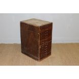 A flight of vintage mahogany filing drawers, thirteen in total, 74cm x 54cm x 39cm lacking top,