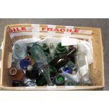 A collection of Victorian coloured and clear glass bottles.
