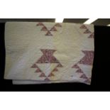 Hand stitched log cabin quilt