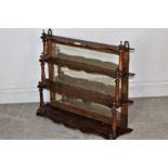 A set f 19th century mirrored mahogany wall shelves, of shaped and graduating form with four tiers