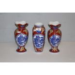 Three Oriental design pottery vases, two of baluster form with flared and waved necks 25cm & 24cm