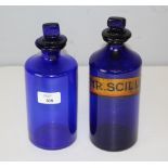 Two Bristol blue glass chemist's bottles, one with painted label for 'SYR.SCILLAE' each with stopper