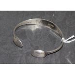 A silver 'Sugar Tong' open annular bangle, form from hall marked bead pattern sugar tongs, 7cm