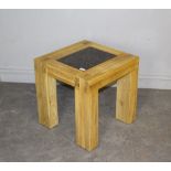 A modern light oak coffee table, with variegated granite insert 50cm x 49cm good condition.