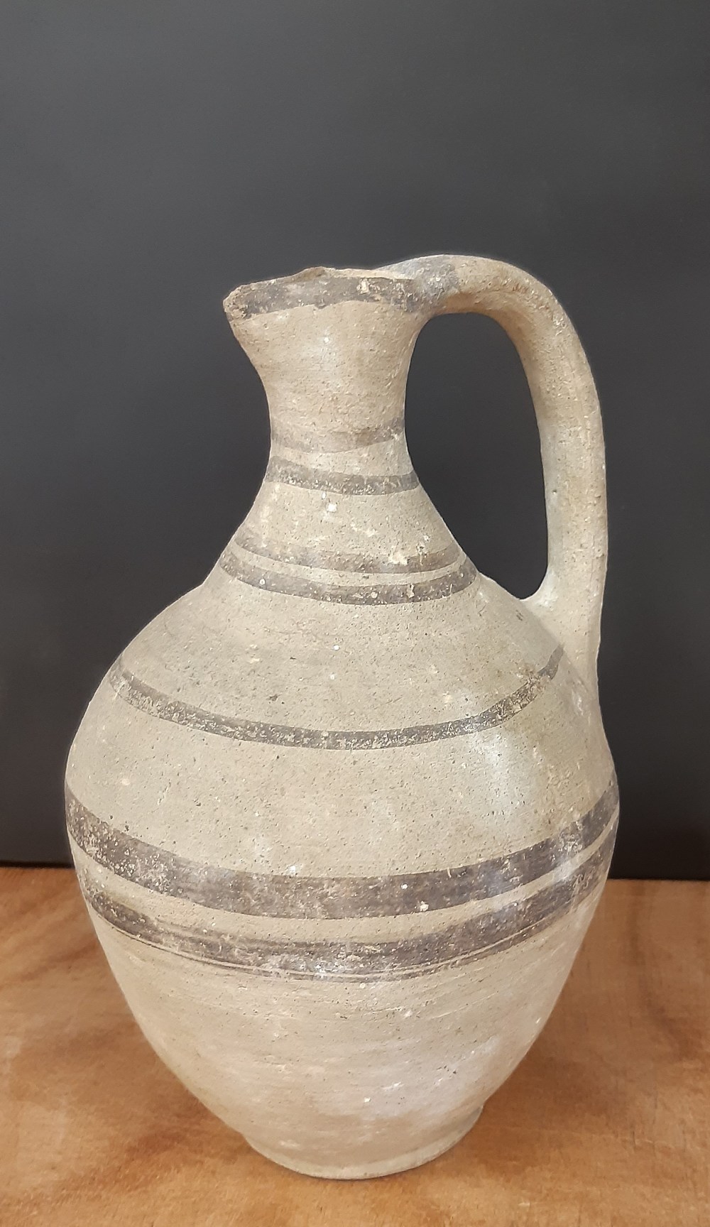 Roman Samian pottery jug, decorated with brown banding and a star, 22cm high, minor decoration