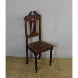 A Victorian mahogany hall chair with 'swan-neck' crest-rail over a pierced central splat and solid