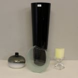 Four items of modern art glass, including a tall black-glass tapering cylindrical vase.