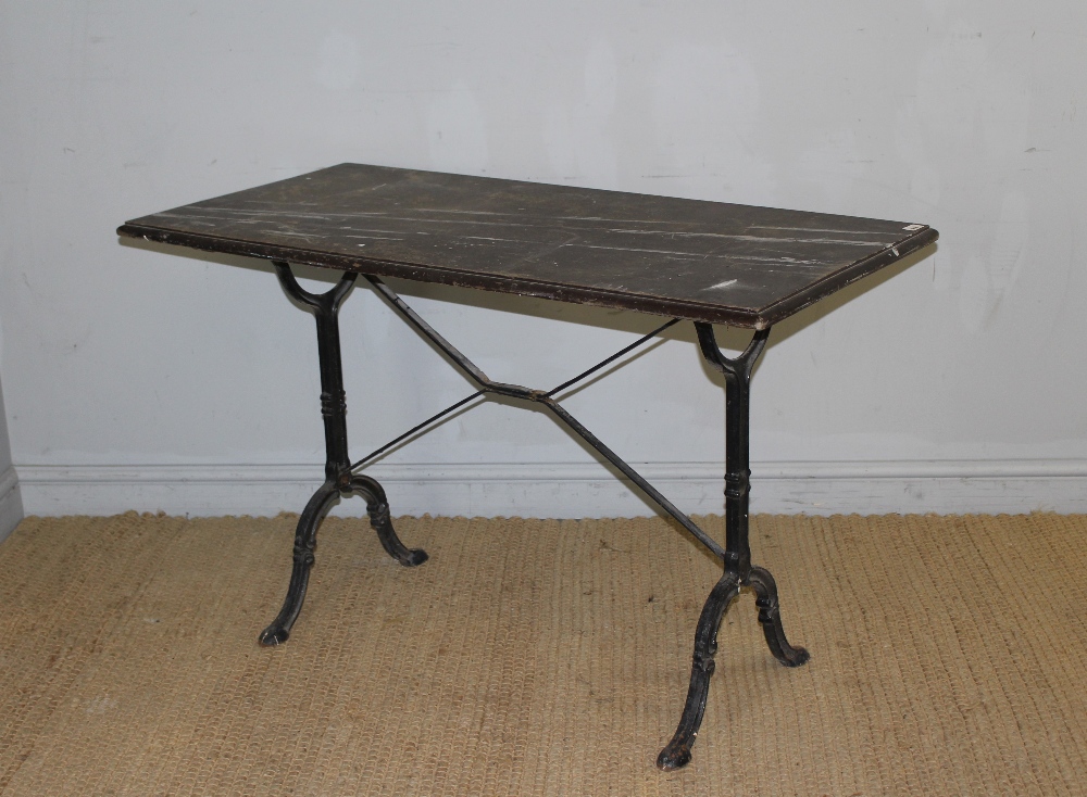 A cast-iron base pub table with moulded rectangular top above scroll cast trestle type supports - Image 3 of 3